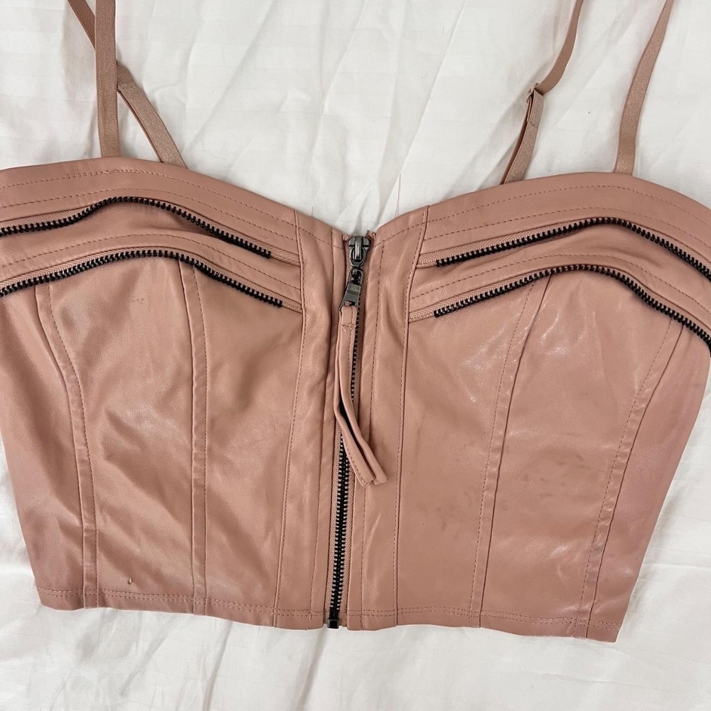 Blush faux leather corset bustier with front zip closure